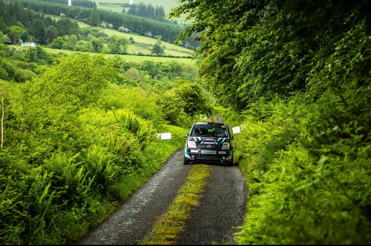 The C2 climbing through the Munster hills, hedges either side